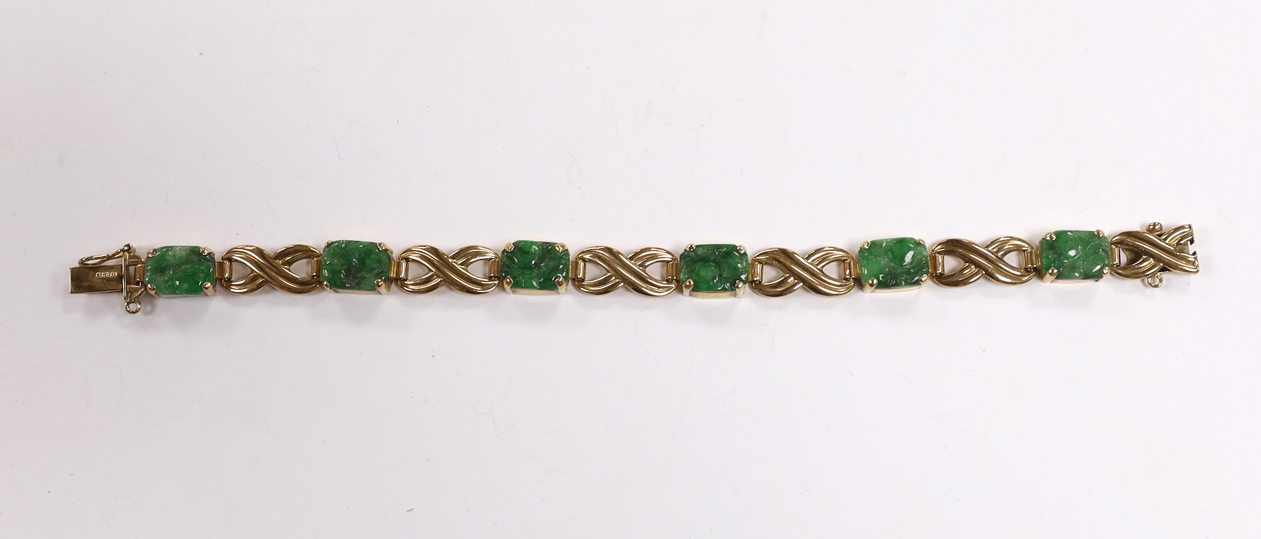 A 1960's 9ct gold and six stone carved jade panel set bracelet, by Cropp & Farr,17cm, gross weight 15.2 grams.